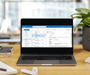 Laptop on desk with PolicyPilot on the screen